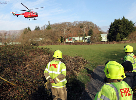 Emergency Services assisting injured person