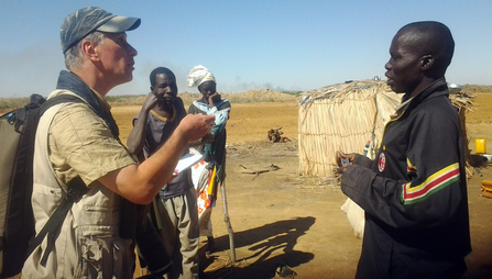 Frederic talks to village member, Oumar Diallo, about Ceulan