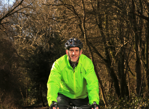 Richard cycling in a wood